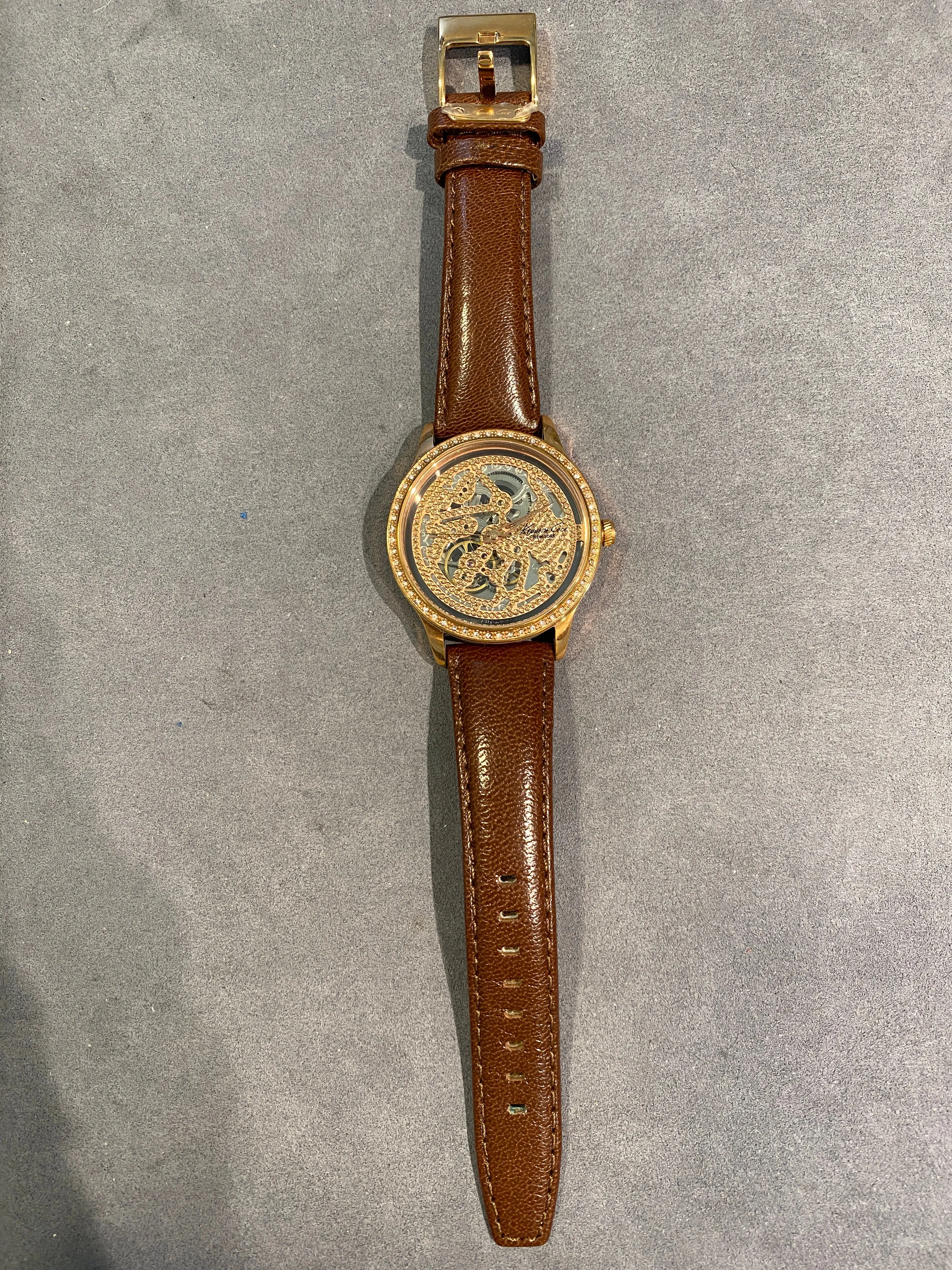 Ladies dress watch with beautiful and striking bronze skeleton dial and diamantes bezel