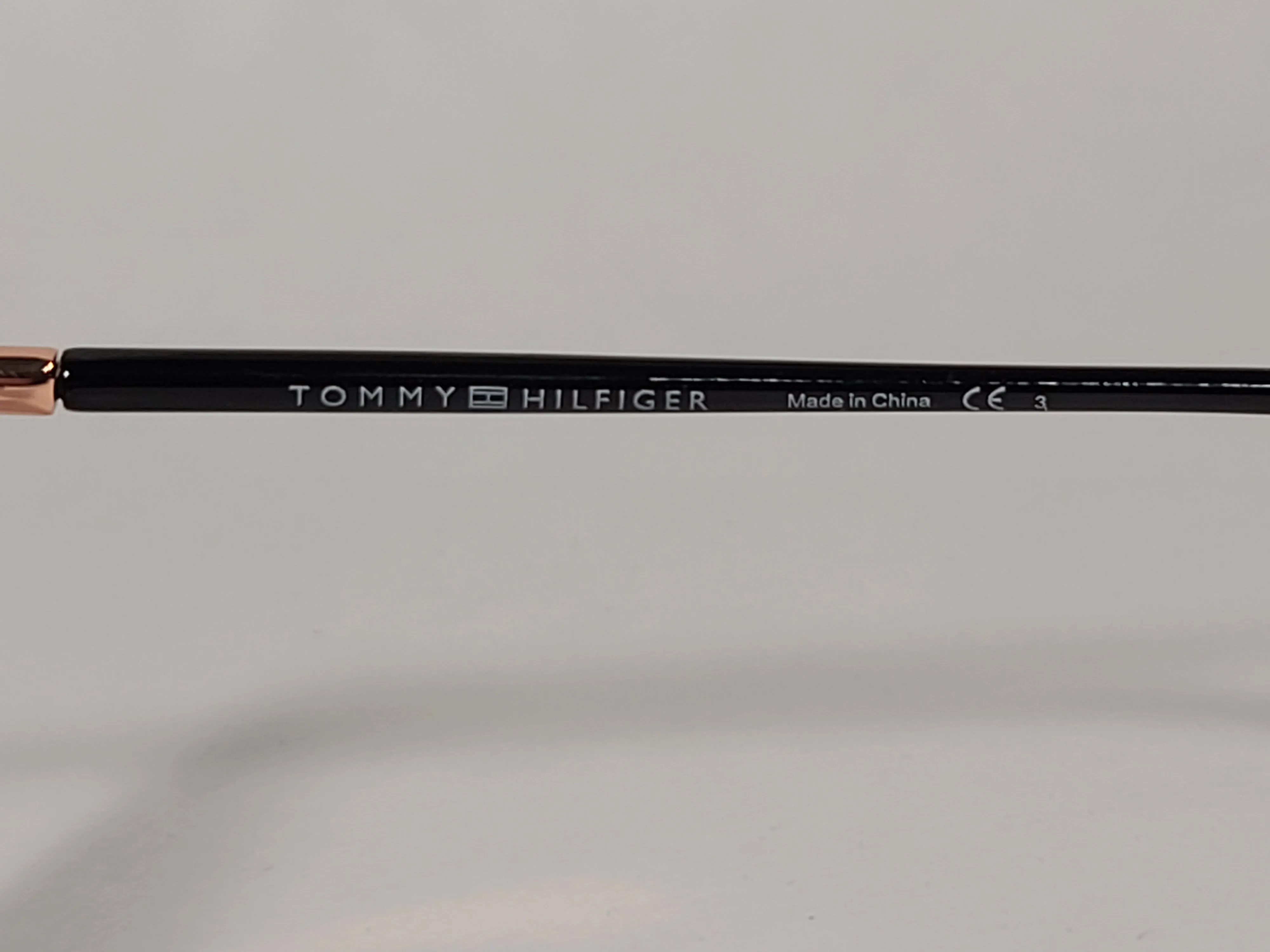 Tommy Hilfiger Shuri Cat Eye Sunglasses Shiny Black and Gold Frame Smoke Gradient Lens WM OL504